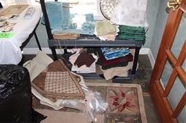 Box lot of many linens napkins, table runners,  place mats, towels, napkin rings, down comforter,  etc.
