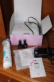 U Spicy nail polish dryer with polish, cotton  pads, etc.

