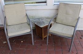 Pair of outdoor chairs with cushions
