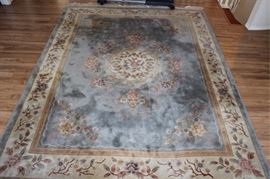 8' x 11' handmade wool rug, blue with floral  design, located on 2nd floor, bring manpower
