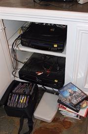 Box lot of video games, VCR, 5 disc CD player
