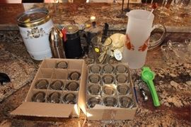 Box lot of barware, shot glasses, pitcher, coffee  grinder, bottle opener, small keg, etc.
