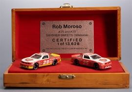 Offered is a pair of matching diecast Rob Moroso Swisher Sweets Oldsmobiles from 1989. The race cars are 1:64 #20 and #25. The display box and the cars are in good condition, showing minimal wear. Please see the photos for more details.