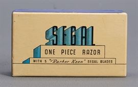 Offered is a 1930s Segal One Piece Razor with % Barber Keen Segal Blades. The razor has never been used and in like new condition. The box shows minor wear. Please see the photos for more details.
