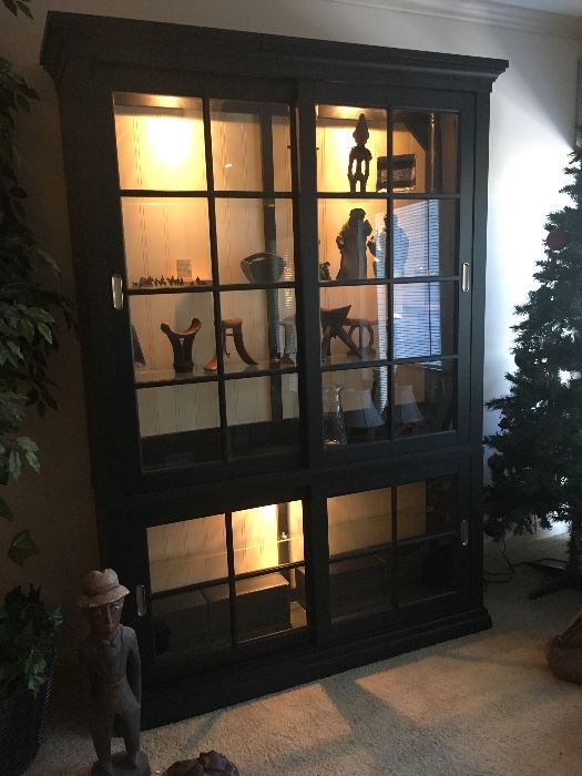 Display cabinet with sliding doors and CD storage bins in bottom
