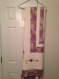 Beautiful handmaid quilt with purple flowers, wonderful stitching. Medium weight.