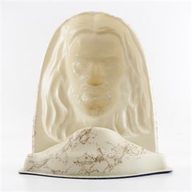 Vintage Light-Up Novelty Jesus Bust Lamp: A vintage novelty light-up Jesus bust lamp. This unique novelty light is made from a molded cream colored plastic material and appears to depict an adult Jesus with long hair and a beard. It has a single light socket and felt to the base. Unlabeled.