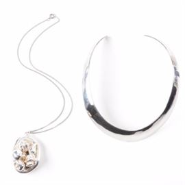 Taxco Sterling Silver Collar Necklace with Relief Pendant Necklace: A pairing of sterling silver necklaces. Featured is a curved collar necklace made in Taxco, Mexico and a pendant necklace. The egg-shaped pendant features a relief abstract design and hangs on a link chain.