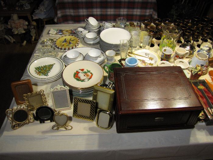 Miscellaneous dishware, photo frames, cups, saucers, and more.
