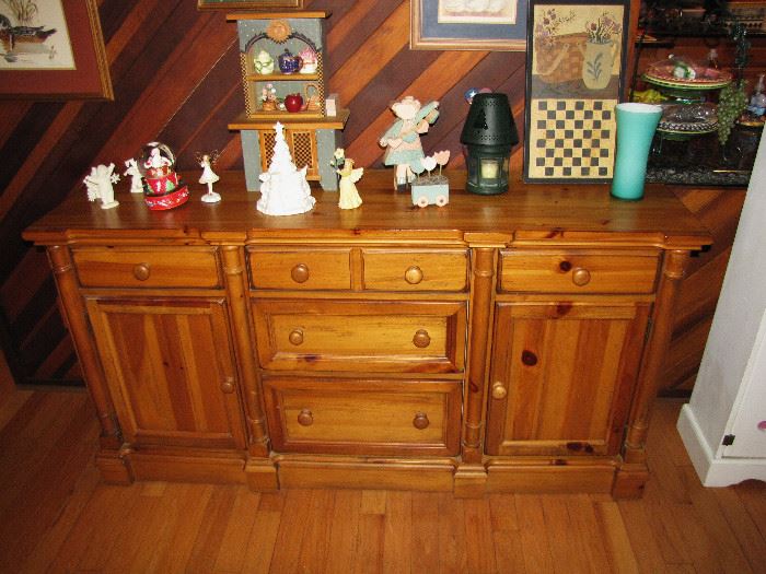 The buffett table underneath other decorative items.