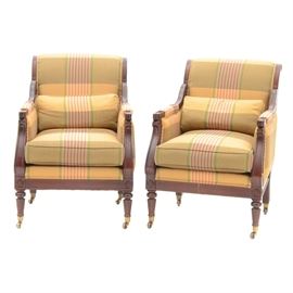 Pairing of Contemporary Arm Chairs: A pairing of contemporary armchairs from the Statesville Chair Company. These armchairs feature mahogany construction with ogee curved top rails and front stiles with carved scrolls at each end of the curves. The back legs are a saber leg while the front are tapering fluted legs and the legs terminate to brass casters. The chairs are upholstered in green and gold-tone damask with red accent stripes and both chairs have a matching accent pillow. Retains label to underside of cushion.