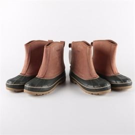 Men's Sporto Duck Boots: A pairing of men’s Sporto duck boots in size 11M. The two matching pairs feature an over-the-ankle design crafted in tan leather with triple stitched shafts and a waterproof latex rubber boot on textured soles.
