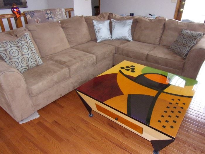 Microsuede sectional excellent condition. Custom made art piece coffee table. Unique conversational piece!