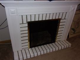 Portable fireplace electric heater.....imagine black or gray paint on brick?