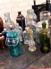 Large antique bottle & mason jar collection along with many books on bottle collecting 