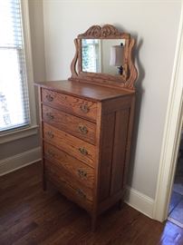 5 Drawer chest with attached mirror. Measures about: 33" long, 16" wide, 46" high