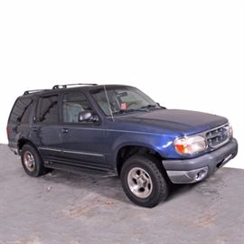 1999 Ford Explorer XLT: A 1999 Ford Explorer XLT, VIN: 1FMDU32E9XZA06171, odometer reads 194,125. This rear wheel drive sport utility vehicle is powered by a fuel injected 4.0L V6 engine and an automatic transmission with overdrive. The vehicle rides on 15" alloy wheels with BFGoodrich all-terrain T/A tires in 235/75.R15 as well as four wheel disk brakes with ABS. The interior features cloth upholstry with plastic trim, manually adjustable bucket seats, AM/FM/CD/Tape stereo, a split folding rear seat and rear storage area. This model also features adjustable roof rails and a tow hitch.