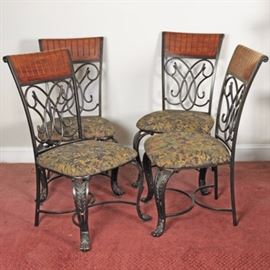 Set of Dining Chairs by Ashley Furniture: A set of four dining chairs by Ashley Furniture. These chairs features a curved crest rail with carved wood upper backrest that rests over the scroll back splat flanked by stiles. The upholstered seat rises above cabriole legs connected by a pair of half circle stretchers.