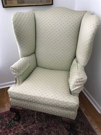 Pale green upholstered wing chair