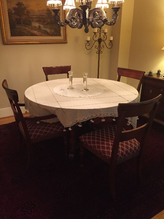 Ethan Allen round dining table, with leaves, 2 arm chairs, and 4 side chairs, table pads.  Excellent condition