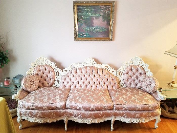 Shabby Chic French provincial white carved sofa. Monet framed art