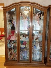Lighted curio cabinet. Hundreds of dolls!