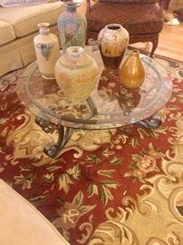 Glass top coffee table with metal base...pottery and ceramic urns