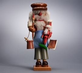 Offered is a vintage wooden nutcracker from Christian Ulbricht. The paint bucket does not hold well on the wire. The original tag is attached. This item is sold as-is. Please see the photos for more details.