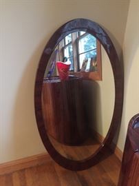 Oval mirror matches the dining room set