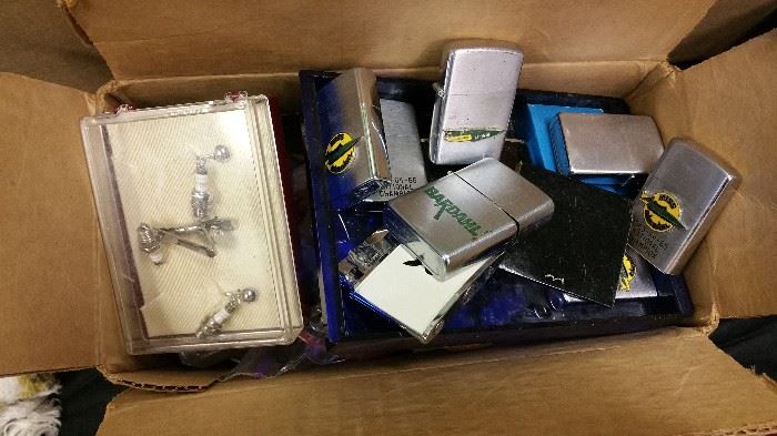 great collection of lighters - Miss Bardahl hydroplane memorobilia....also Champion spark plug jewelry!!  