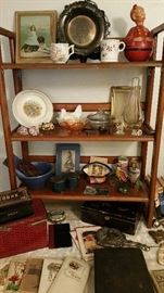detail of shelf #1 - tobacco tins, Victorian poetry books, jewelry box, postcard scrapbook, vintage glassware, child's plate, small Swarovskis, shaving mugs, silver plate bride's bowl, antique papier mache roly poly, Bauer bowl, Scandinavian tine box, sterling hand mirror.....ETC!