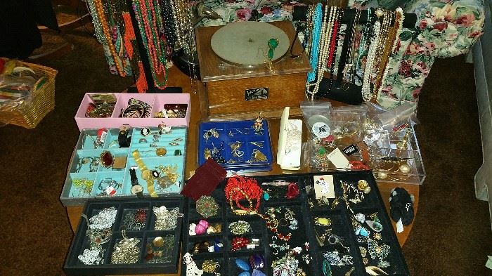 table full of costume jewelry, new and vintage....table top phonograph