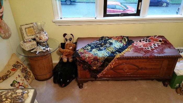 nail keg table - embroidered pillows - shells and shell box, frame - vintage stuffed animals - vintage cedar chest - silk piano scarf