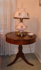 Duncan Phyfe style leather top pedestal  drum table
Hurricane lamp