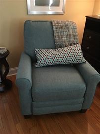 Teal/Blue reclining chair many decorative pillows and blankets