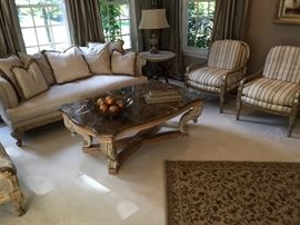 Embassy silk sofa, Pallazzo silver brush, fringe on pillows. Some sun damage to top and back. 82"x42"x31". Henredon marble top coffee table 5&"x39"x22".