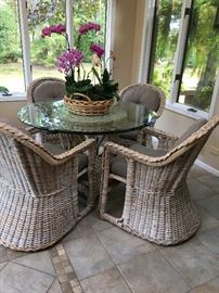 Amazing Wicker patio table with glass top, great inside and out. American Made!!!! with 4 comfy chairs $500 presale Price