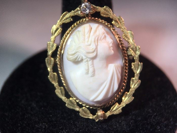 Carved cameo set in gold with diamond