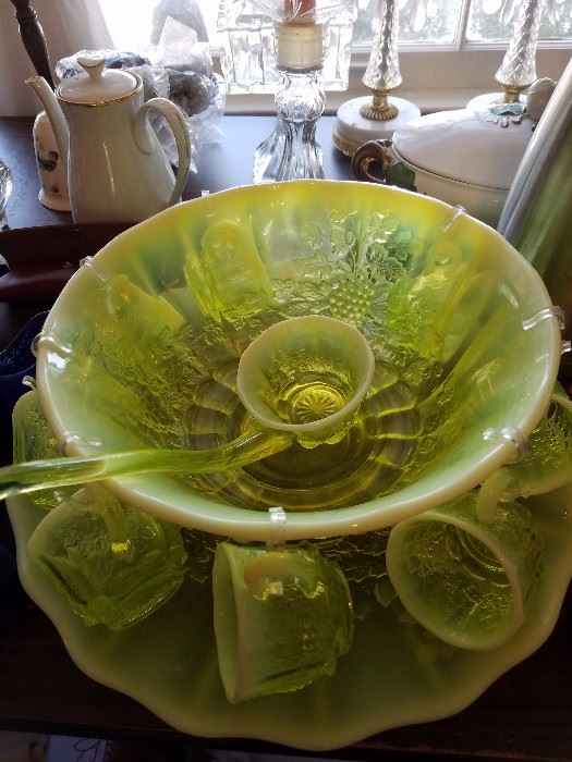 Beautiful rare vaseline glass punch bowl with cups and ladle and plate. Rare to find!!