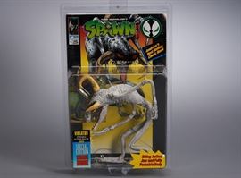 Offered is a carded Spawn figure from the 1990s, packed in a plastic case. There is minimal shelf wear. Please see the photos for details.