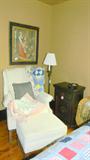 wing back, end table/chest painted with roses, brass floor lamps, antique photographs, quilts