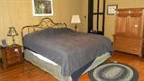 Brass plated head board king size with very nice mattress & box springs, antique braided rug made from a circut riding ministers wool suits by daughter, Oak chest, Mahogany small chests-2,