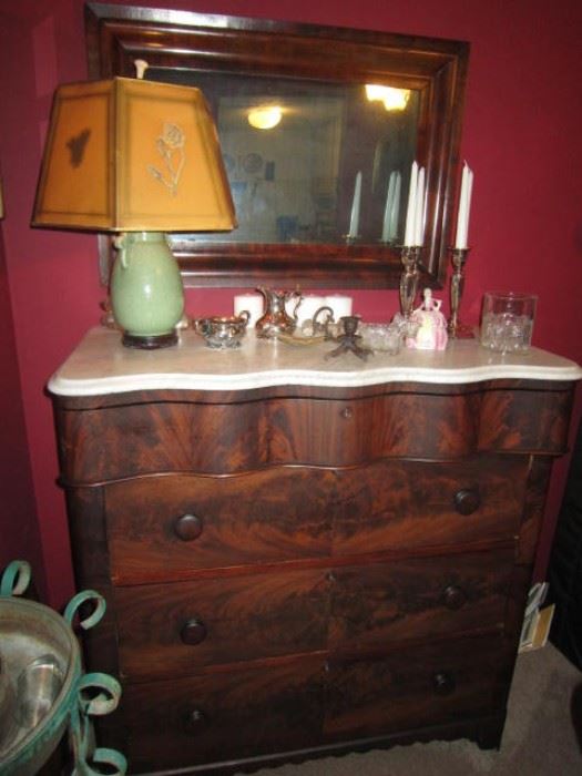 Mahogany dresser with marble top and serpentine drawer.
