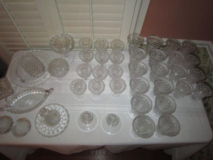 Fostoria American clear-8 low water goblets, 12 iced teas, 12 champagnes, compote, tidbit, 12" boat, 12 salad plates, coasters, jam and jelly, cruet, tray with center handle