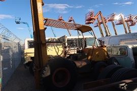 The lifts in the back ground are from the neighbor.  Those ARE NOT in this sale.