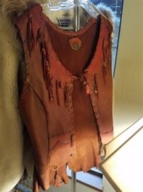 Some of the woman's clothing...this is a wonderful handmade leather vest! What do you think from the 70's?