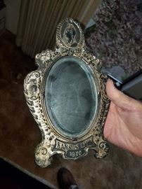 1910 says it all. Pewter? Mirror?