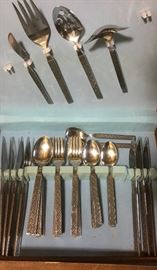 Sets of 1960's vintage stainless flatware. different patterns.