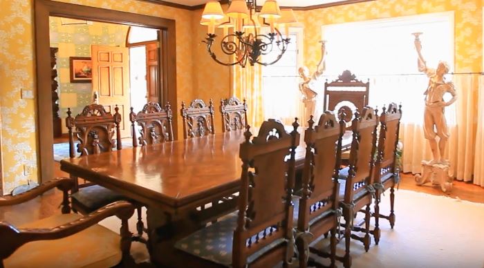 Stunning dining room table which extends even longer with high back carved chairs