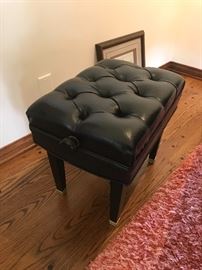 Black leather upholstered piano seat